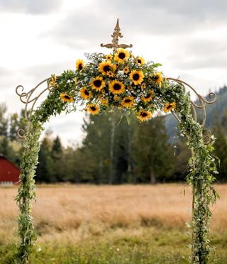 Ceremony arbor with Sunflowers at Mount Peak Farm
