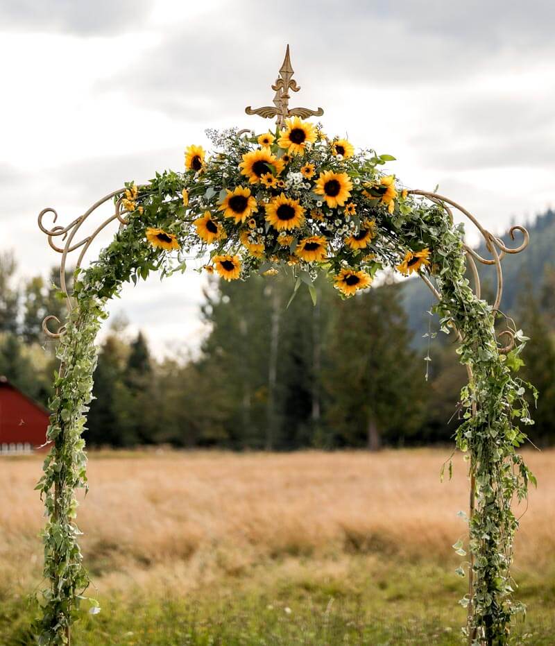 Ceremony arbor with Sunflowers at Mount Peak Farm