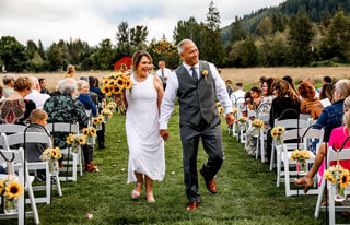 Bride and groom recessional at sunflower wedding at Mount Peak Farm