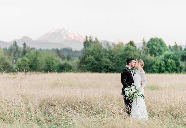 French Countryside Wedding Inspiration Bride and Groom kissing in hayfield