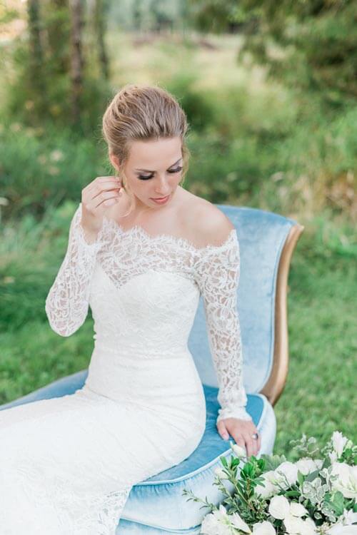 French Countryside Wedding Inspiration bride on vintage velvet chair