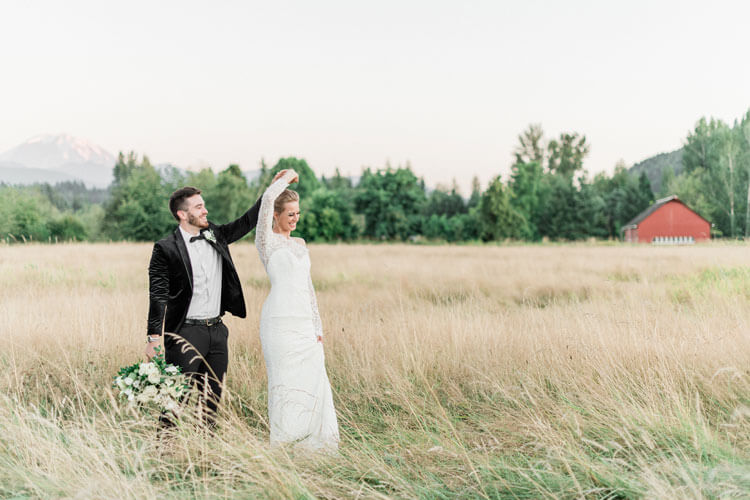 French Countryside Wedding Inspiration Bride and Groom dancing in hayfield