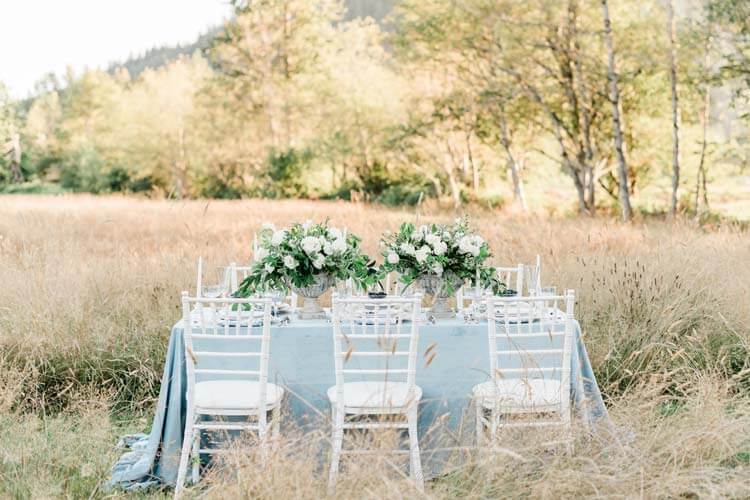 French Countryside Wedding Inspiration reception table in field