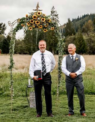 Groom waiting at sunflower arbor