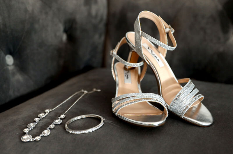 Wedding shoes and jewelry in bridal cottage