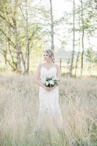 Romantic blush wedding bride in field at Mount Peak Farm