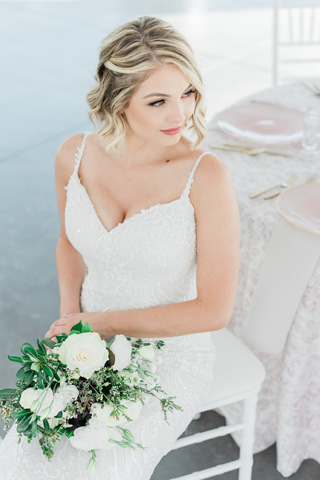 Romantic blush wedding bride at reception table