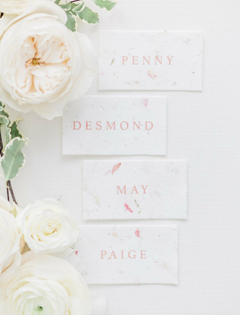 Romantic blush wedding place cards with flowers