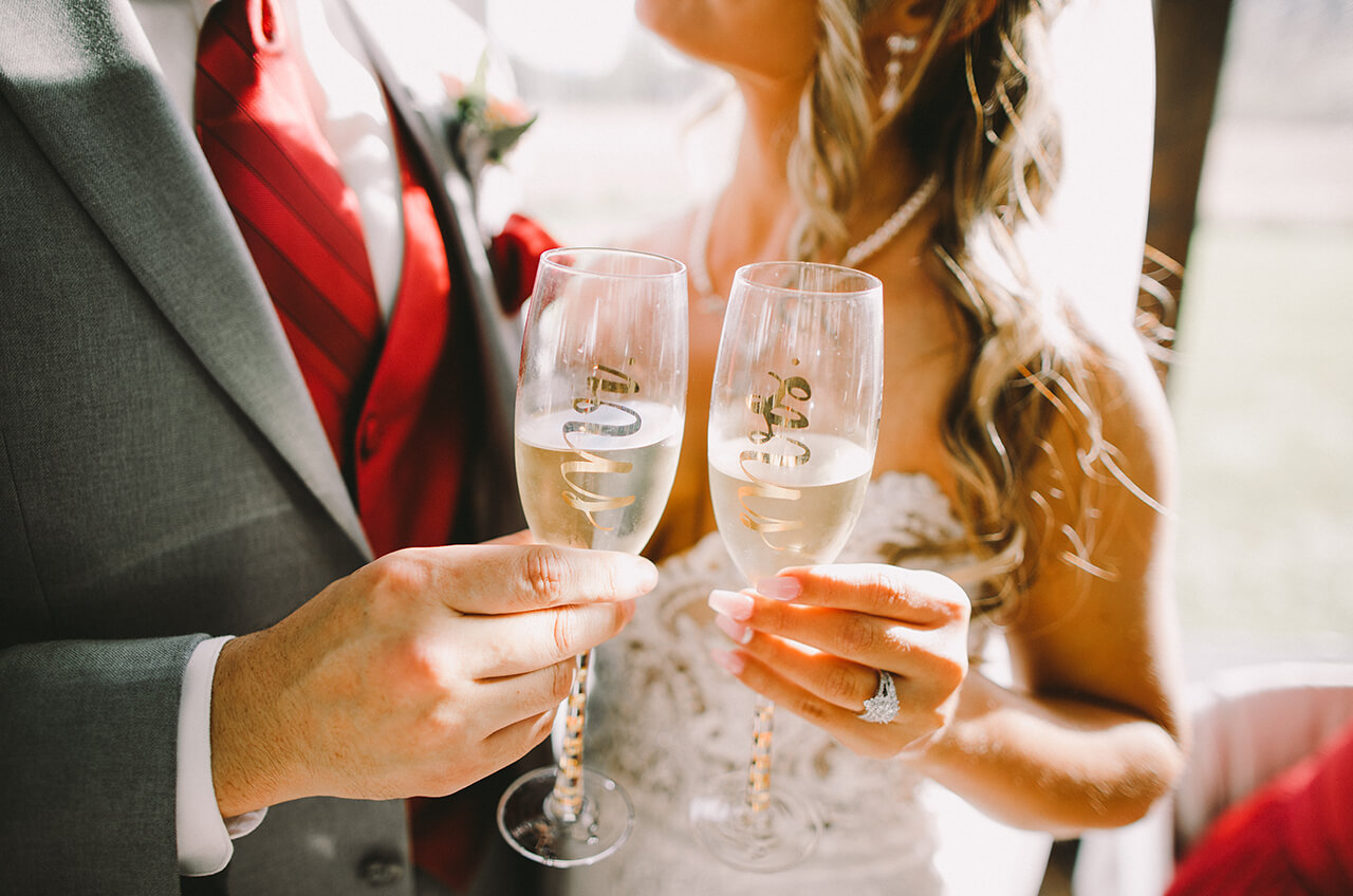 Roxanne and Javier toast champagne