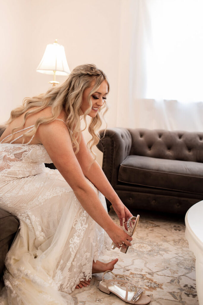 Beautiful Blush bride in bridal cottage with shoes