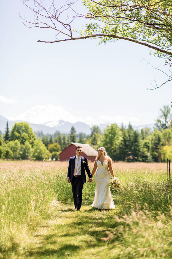 Bride and Groom walking in field