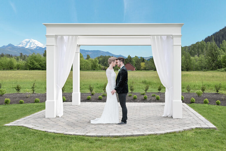 Mount Peak Farm white arbor with wedding couple