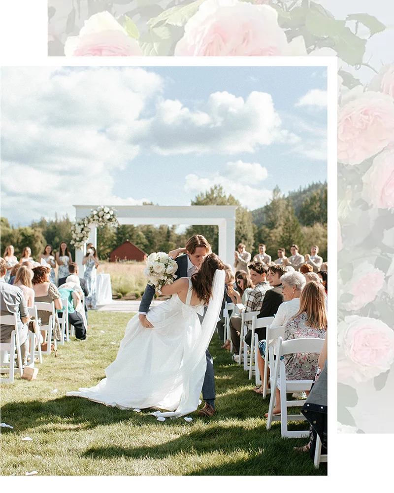 Groom dipping bride and kissing after ceremony at Mount Peak Farm wedding venue.