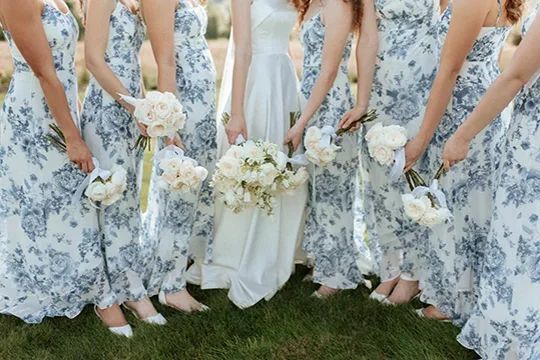 Bridal bouquets with bride and bridesmaids blue dresses at Mount Peak Farm wedding venue