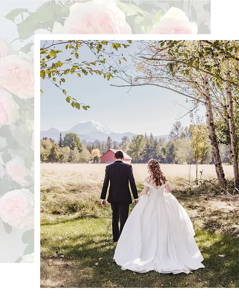 Bride with dramatic ballgown and groom walking towards Mount Rainier view in field at Mount Peak Farm wedding venue