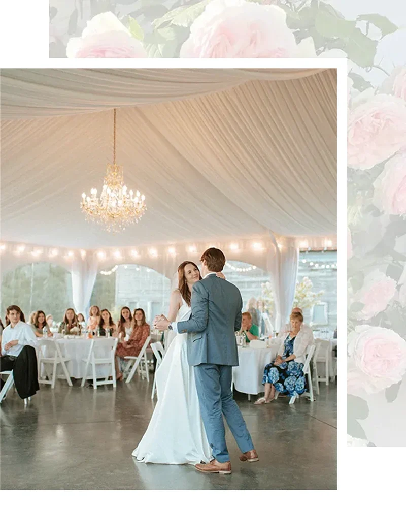 Bride and groom dancing under crystal chandeliers in the reception tent at Mount Peak Farm wedding venue