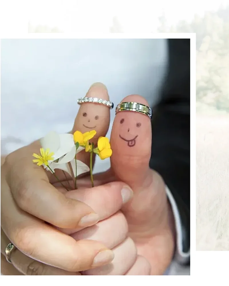 Bride and Groom Thumbs with smiley faces and wedding rings as crowns